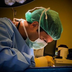 Dr. Stephan Shuaib performing plastic surgery.